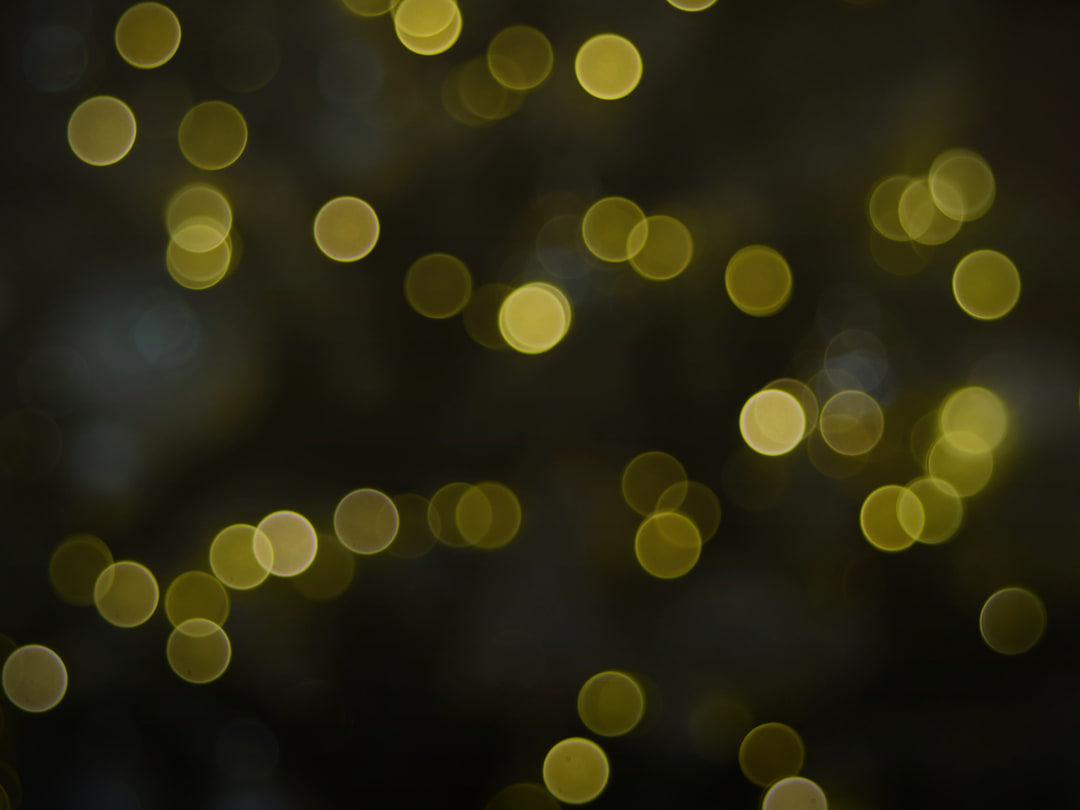 Soft golden light suspended in darkness: rewards that flow steadily, privately